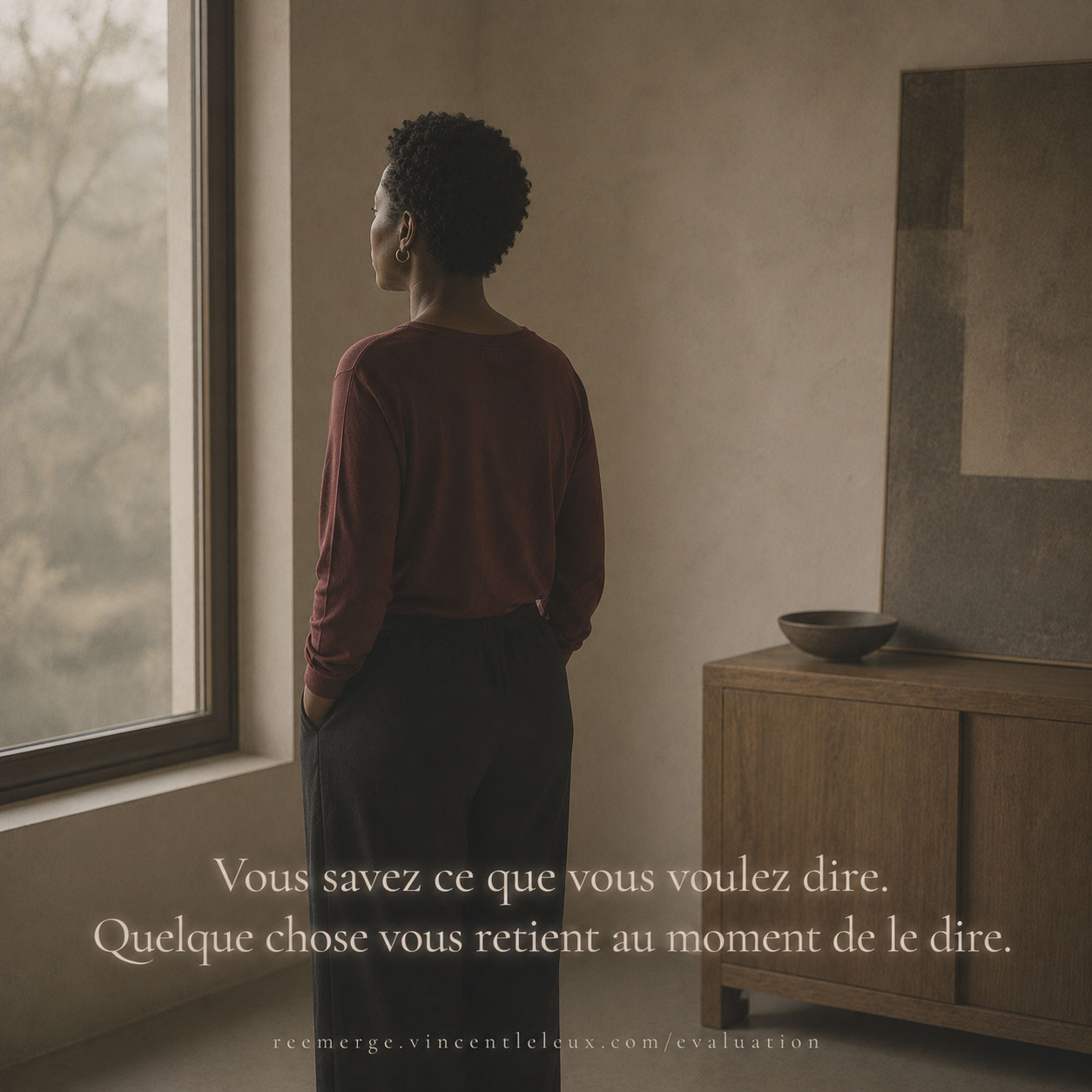 Black woman with short hair near a window, Re-Emerge