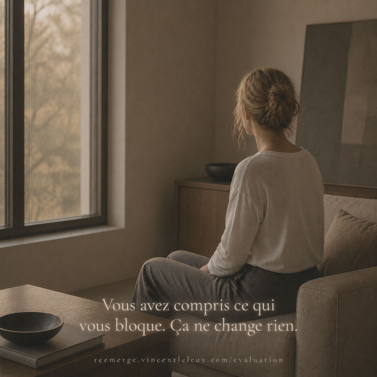 Blonde woman seated on a sofa near a window, Re-Emerge