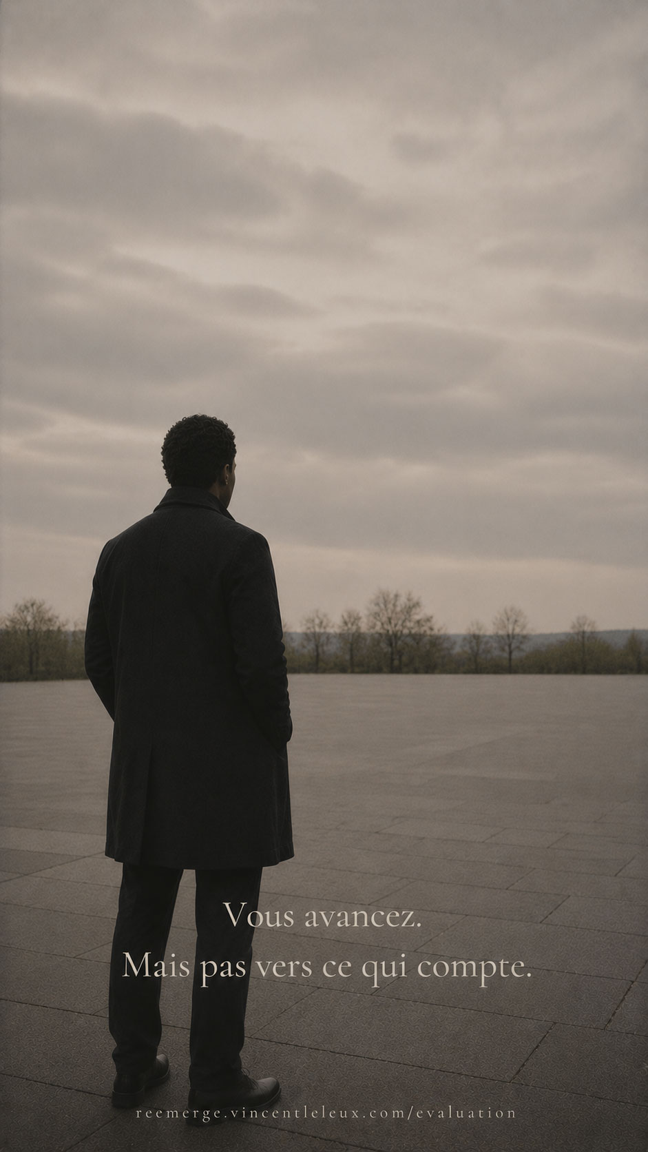Black man standing in a large open plaza, Re-Emerge