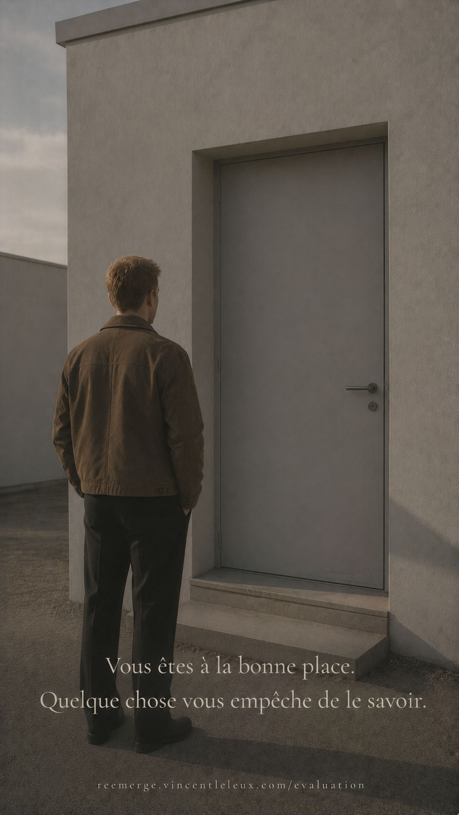 Man with auburn hair standing in front of a closed door, Re-Emerge
