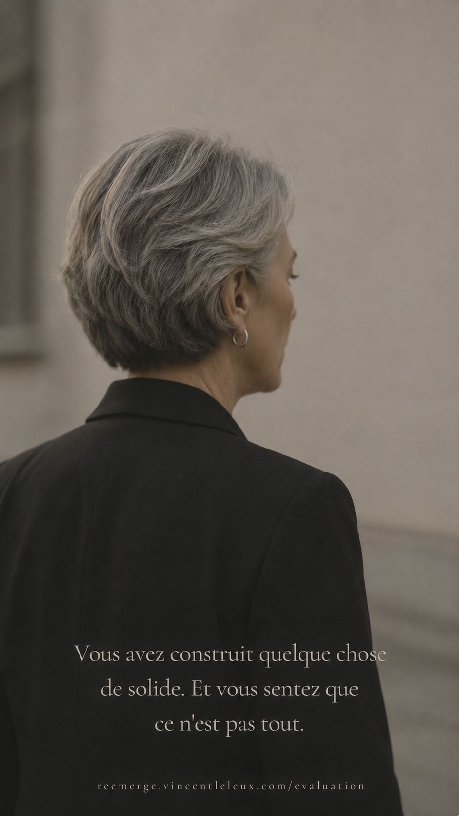 Woman with grey hair close-up seen from behind in black jacket, Re-Emerge